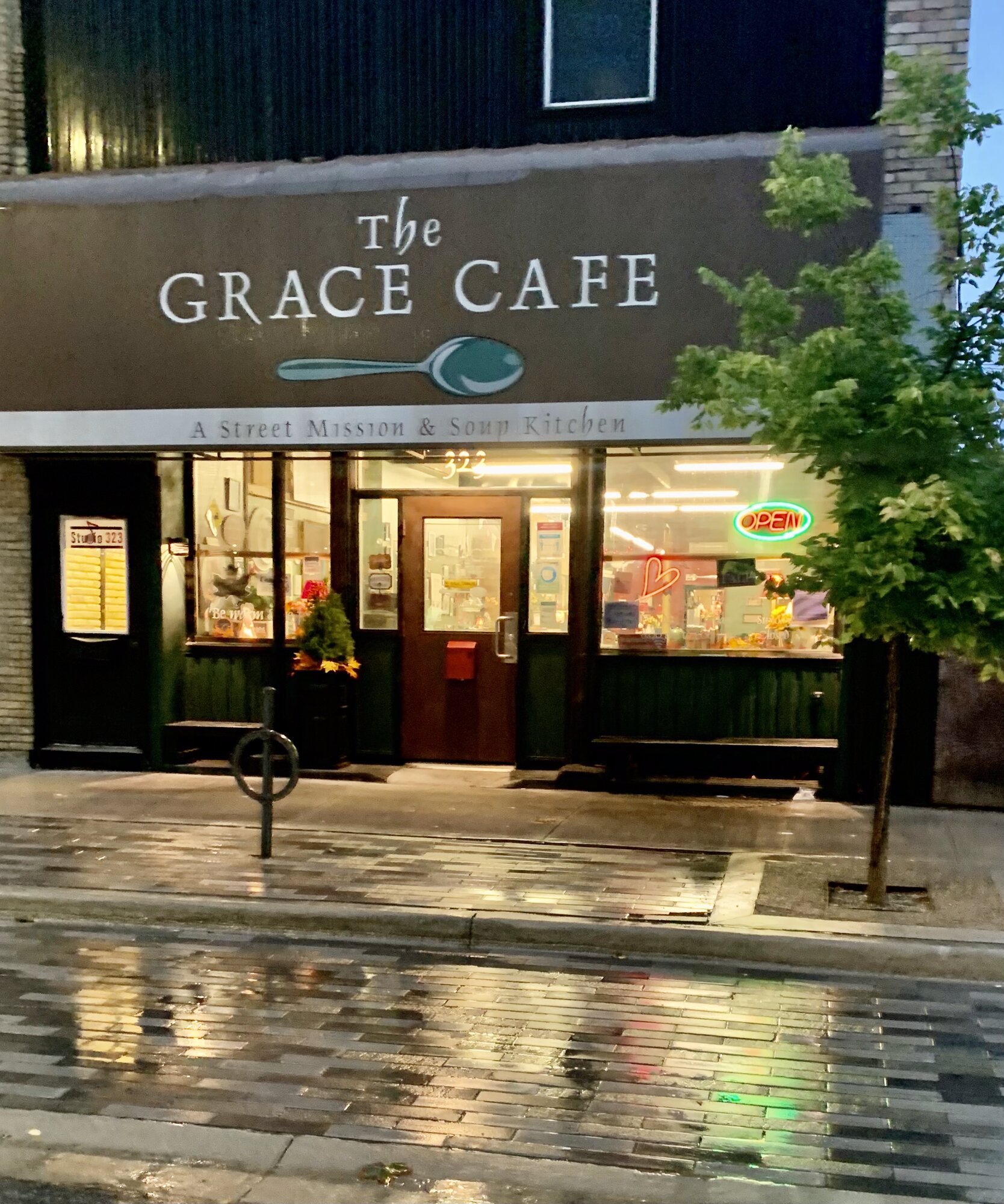 The Grace Cafe storefront at night