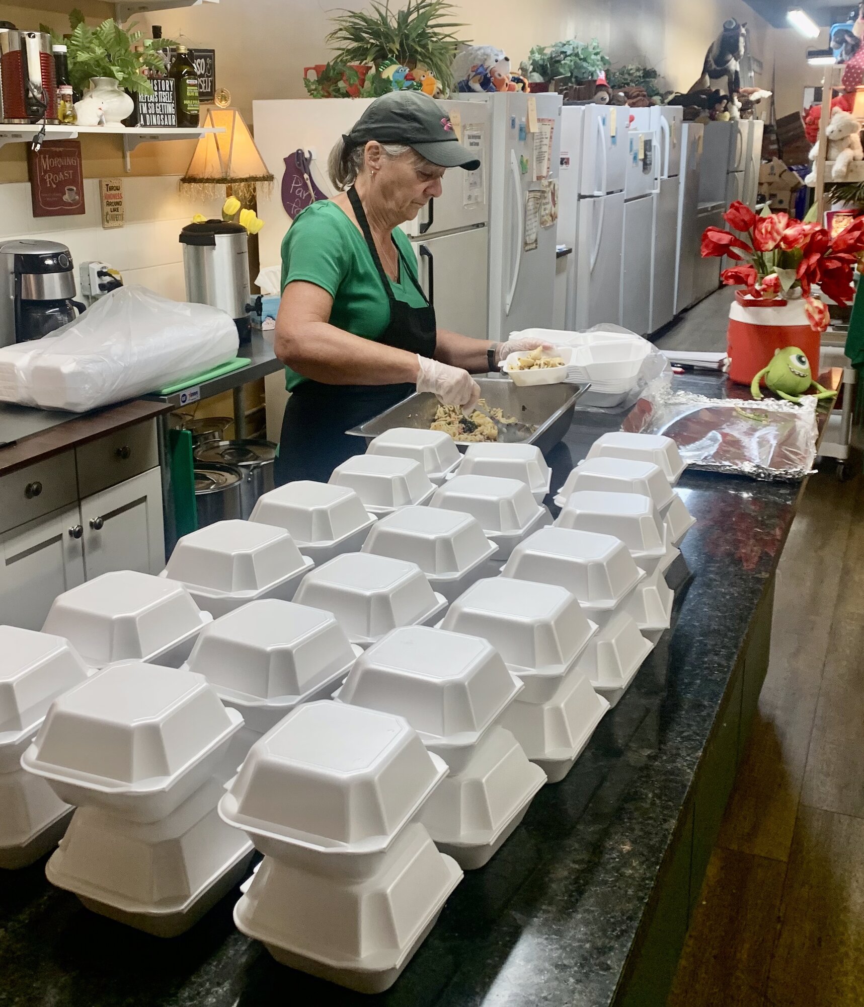 Volunteer packing meals
